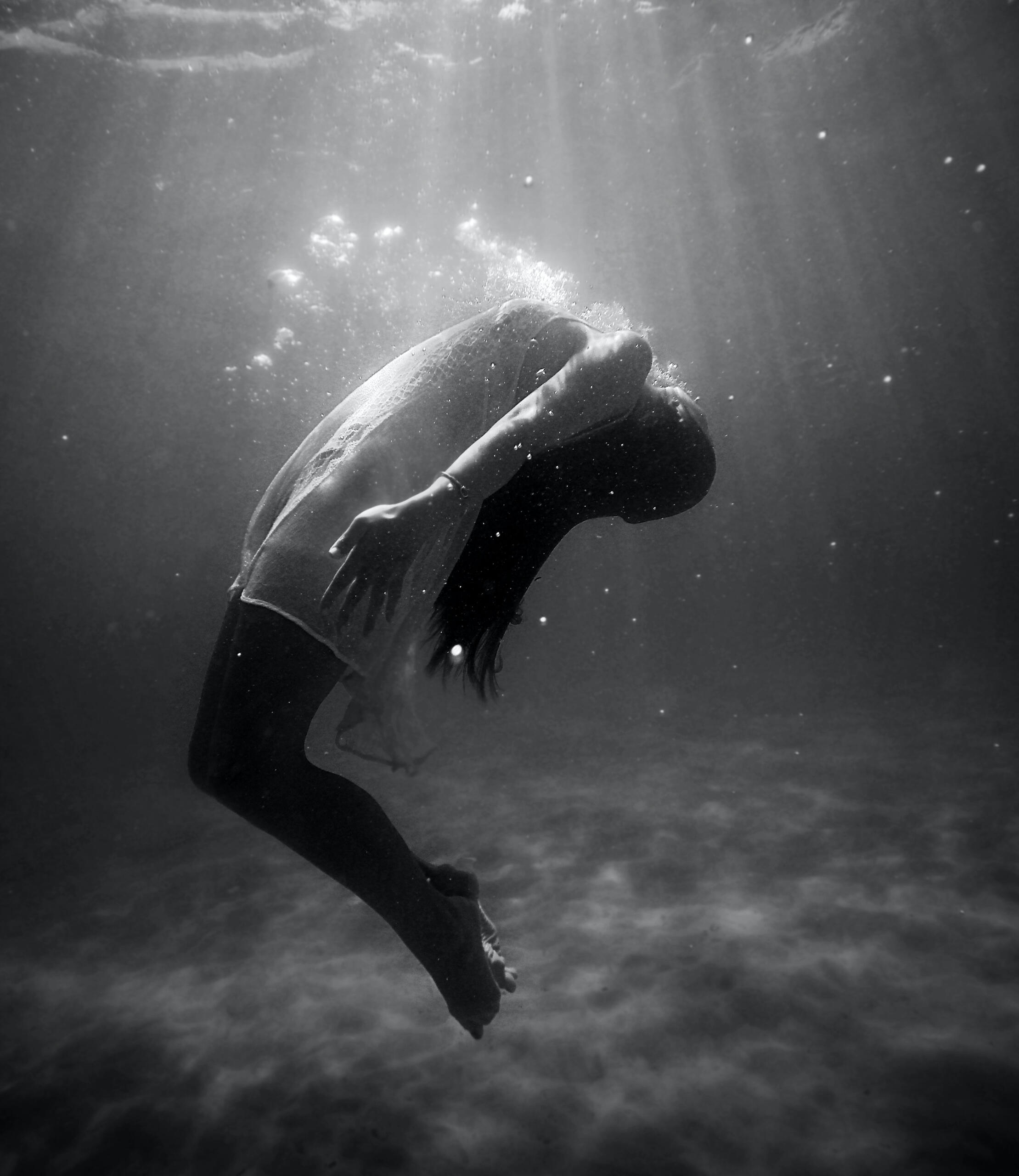 Woman floating under the water